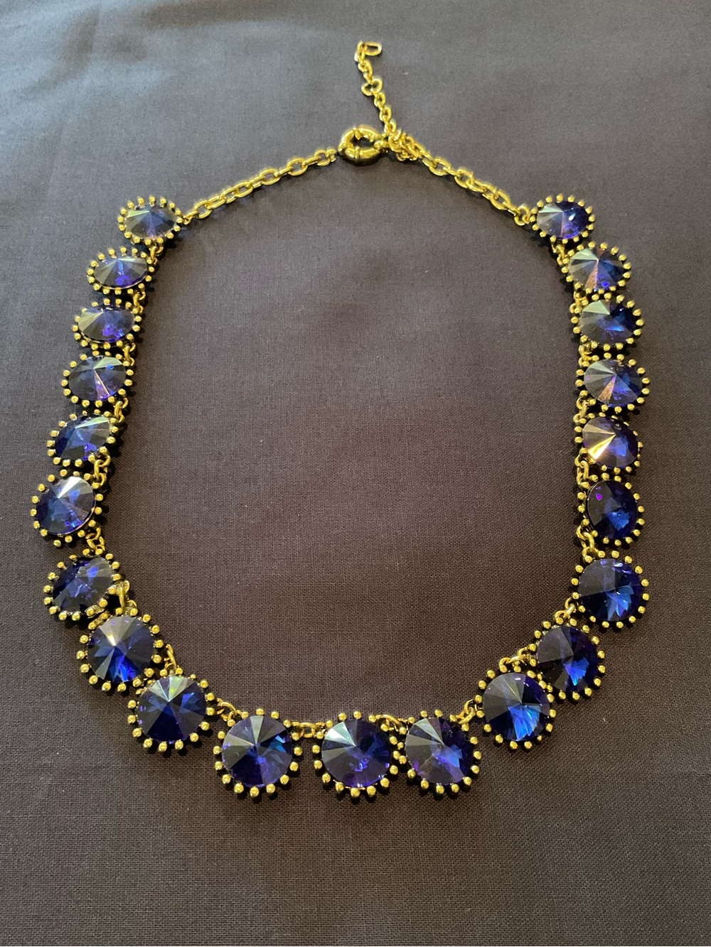 Elegant Gold-Tone Necklace with Deep Blue Crystal Accents